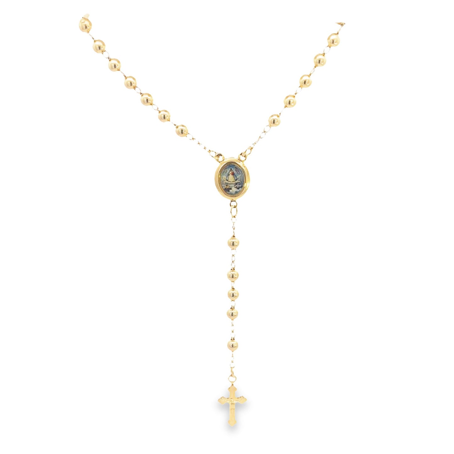 A polished gold rosary necklace hangs against a white background, featuring round gold beads, an oval centerpiece, and a delicate cross pendant.