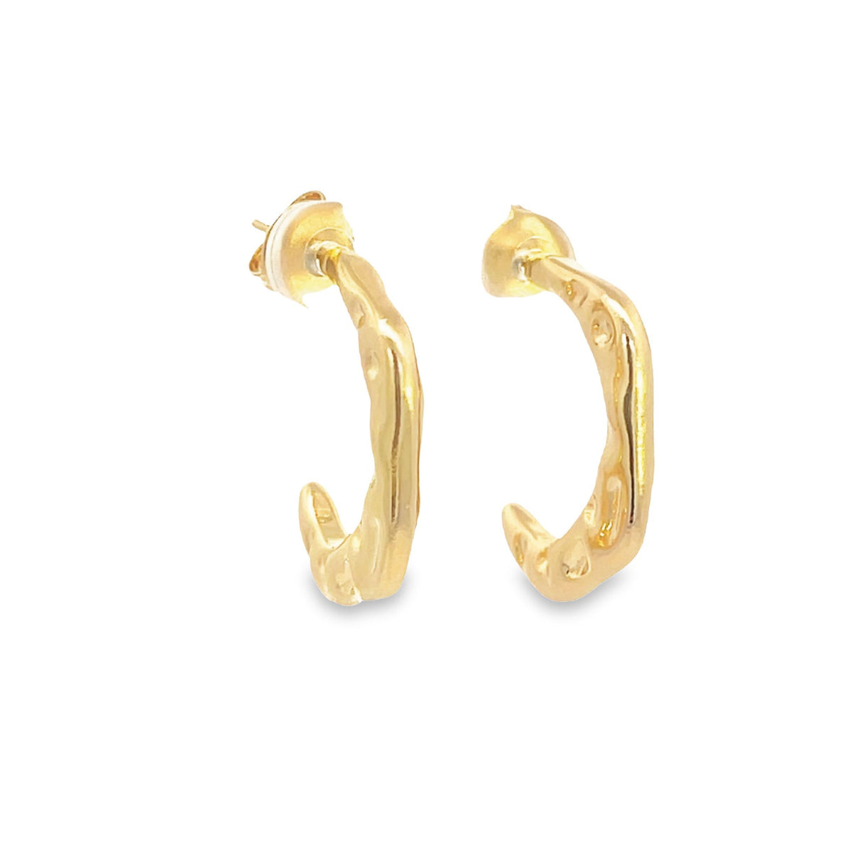 A pair of textured gold hoop earrings displays an organic, hammered design against a clean white background.