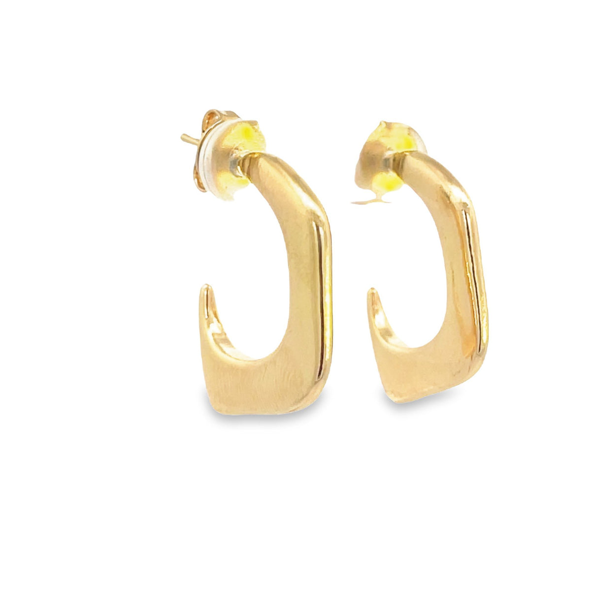 A pair of sleek gold geometric hoop earrings rests against a clean white background.