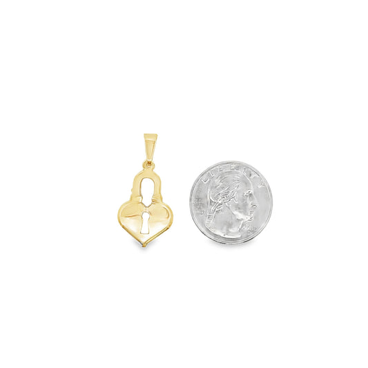 A gold heart-shaped padlock pendant rests next to a US quarter coin for scale.