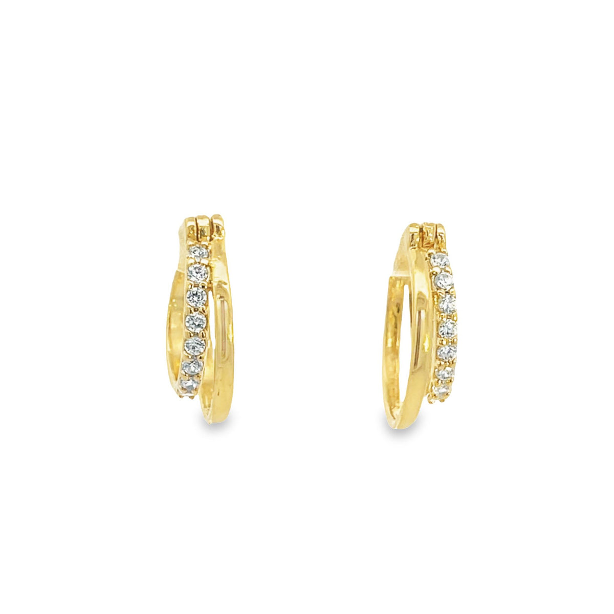A pair of elegant gold hoop earrings features a dazzling row of embedded diamonds against a plain white background.