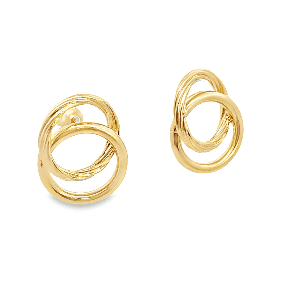 A pair of interlocking gold hoop earrings gleams against a clean white background.