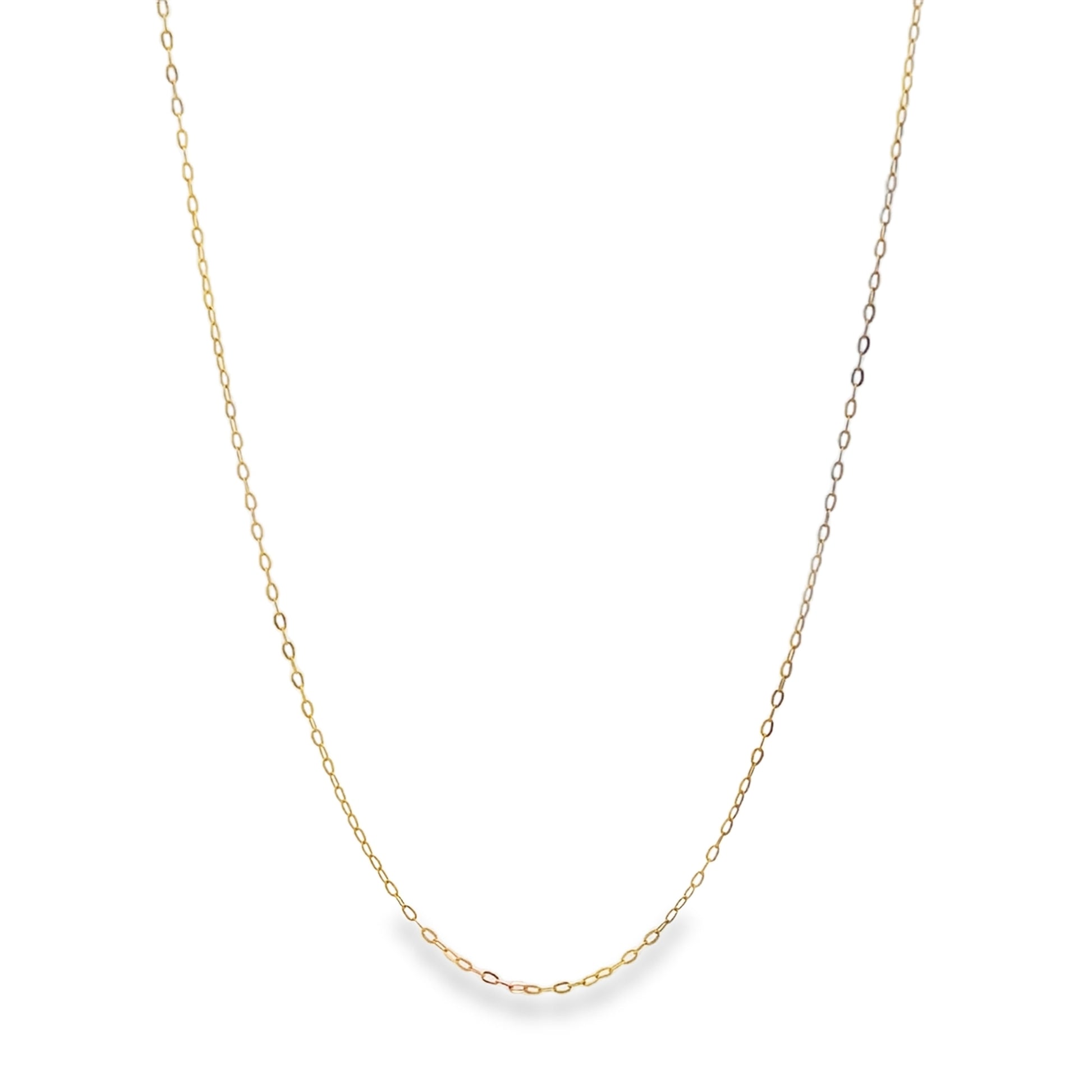 A delicate gold chain necklace drapes against a clean white background.