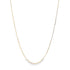 A delicate gold chain necklace drapes against a clean white background.