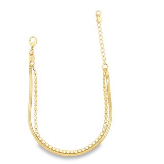 A delicate double-strand gold bracelet features a flat snake chain paired with a matching coin chain against a white background.