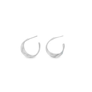A pair of sleek silver multi-strand hoop earrings rests against a clean white background.