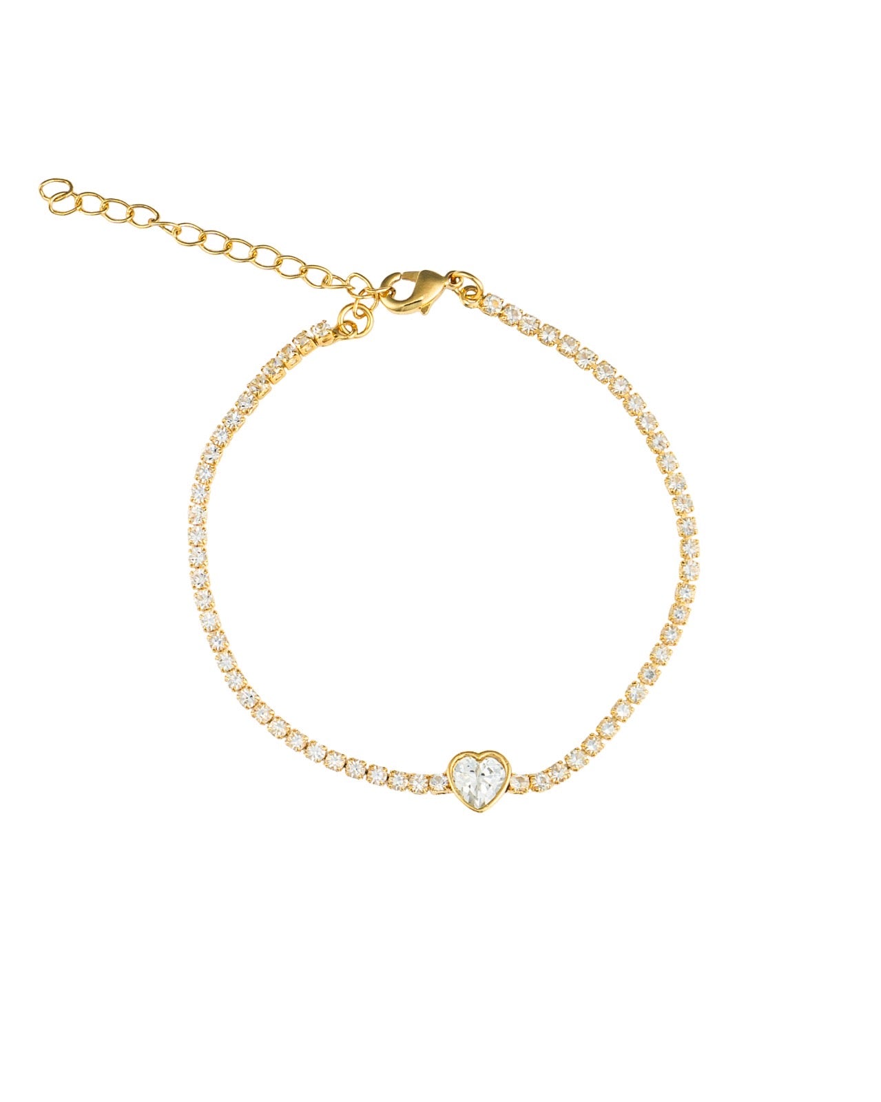A delicate gold tennis bracelet features a sparkling crystal heart charm and an adjustable chain against a white background.