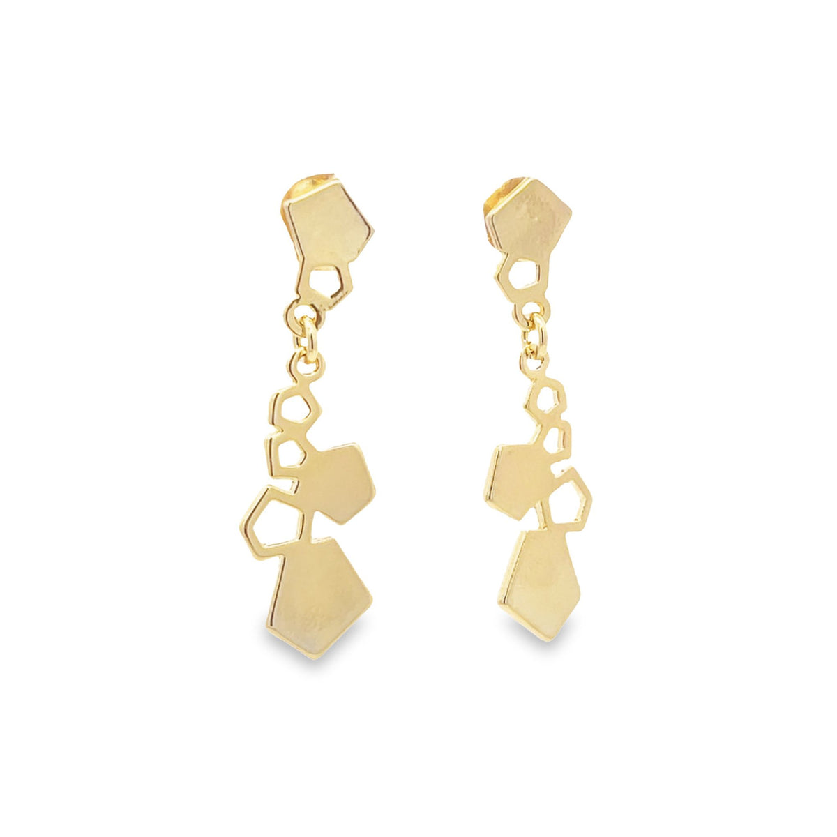 A pair of dangling gold geometric earrings featuring interlocking polygon shapes against a clean white background.
