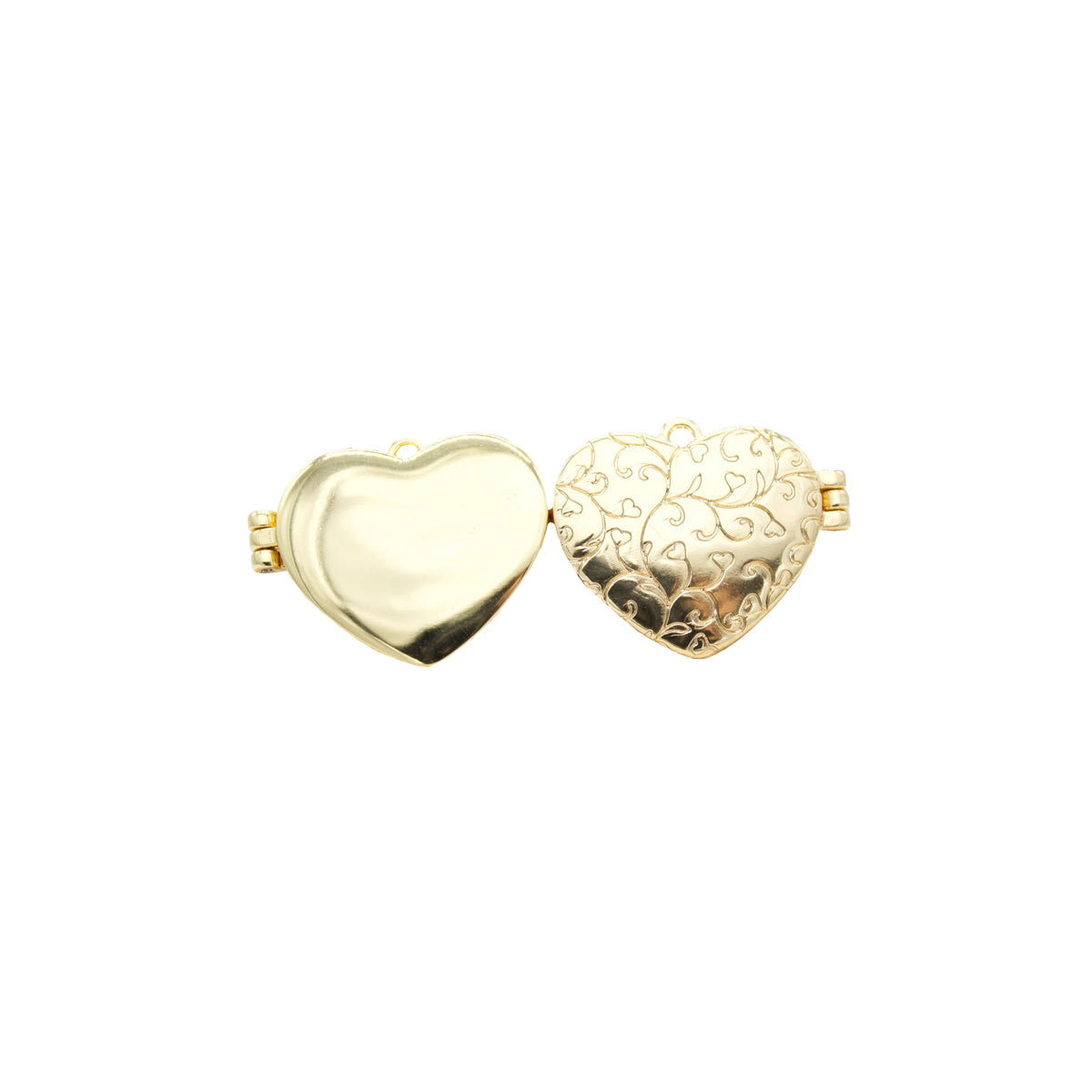 An open gold heart locket displays an engraved filigree pattern on one side against a plain white background.