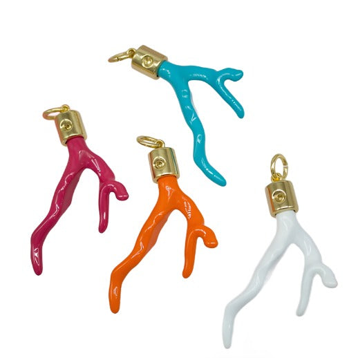 Four colorful coral branch charms with gold-plated caps rest on a white surface, featuring vibrant shades of turquoise, pink, orange, and white.