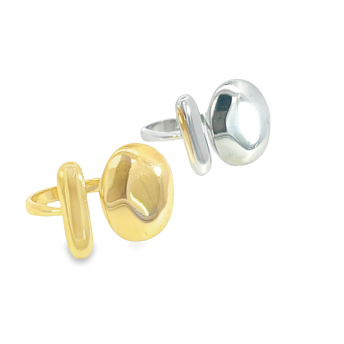 Two minimalist statement rings display abstract geometric shapes in polished gold and silver finishes against a clean white background.