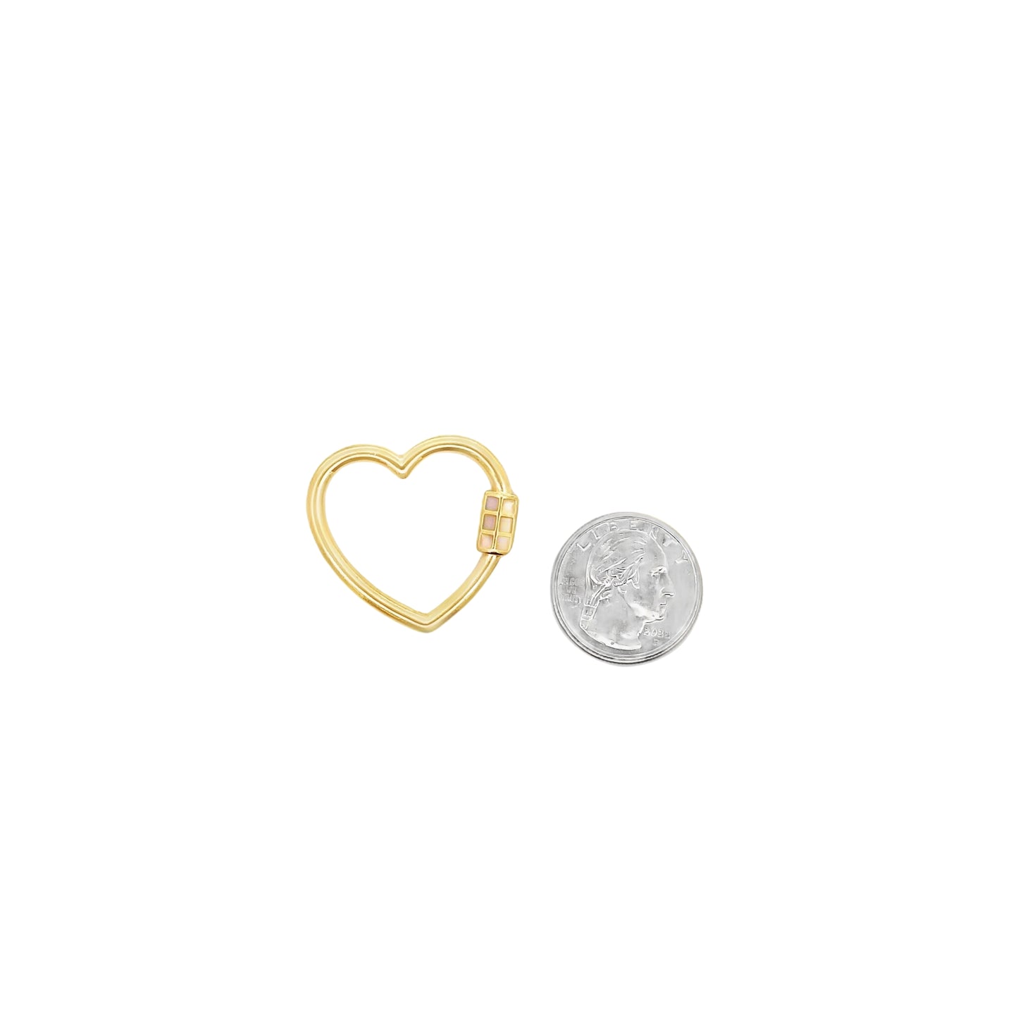 A gold heart-shaped charm clasp rests beside a US quarter for scale on a white background.