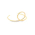 A modern gold cuff earring features a unique double-loop design resting on a white surface.