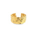 A wide, gold-plated cuff bracelet showcases an organic, hammered texture against a clean white background.