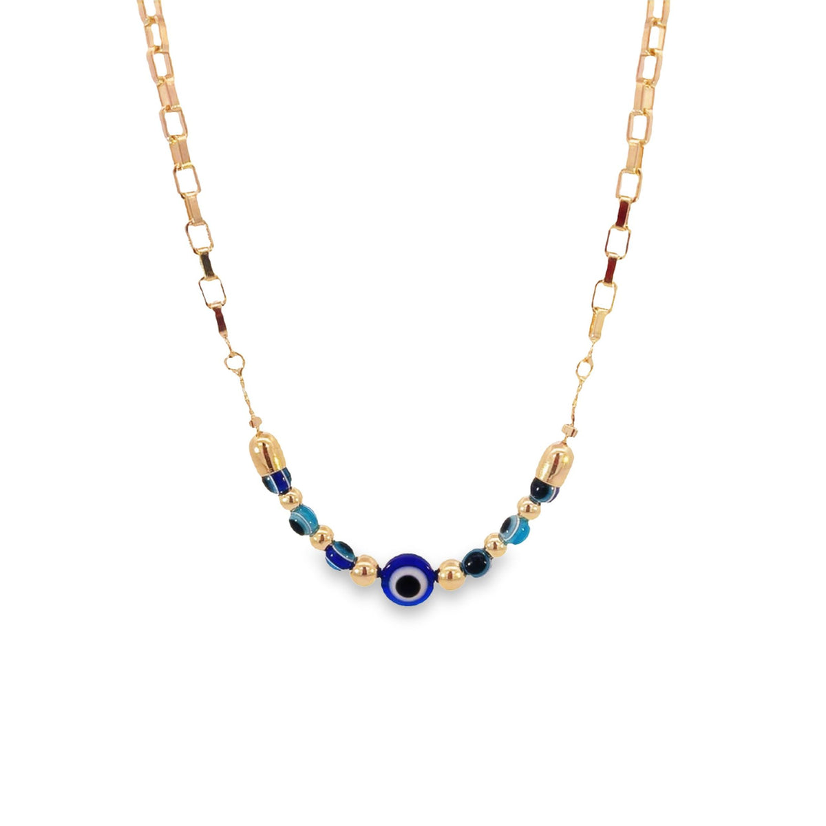 A delicate gold chain necklace features a central evil eye amulet accented with blue beads against a plain white background.