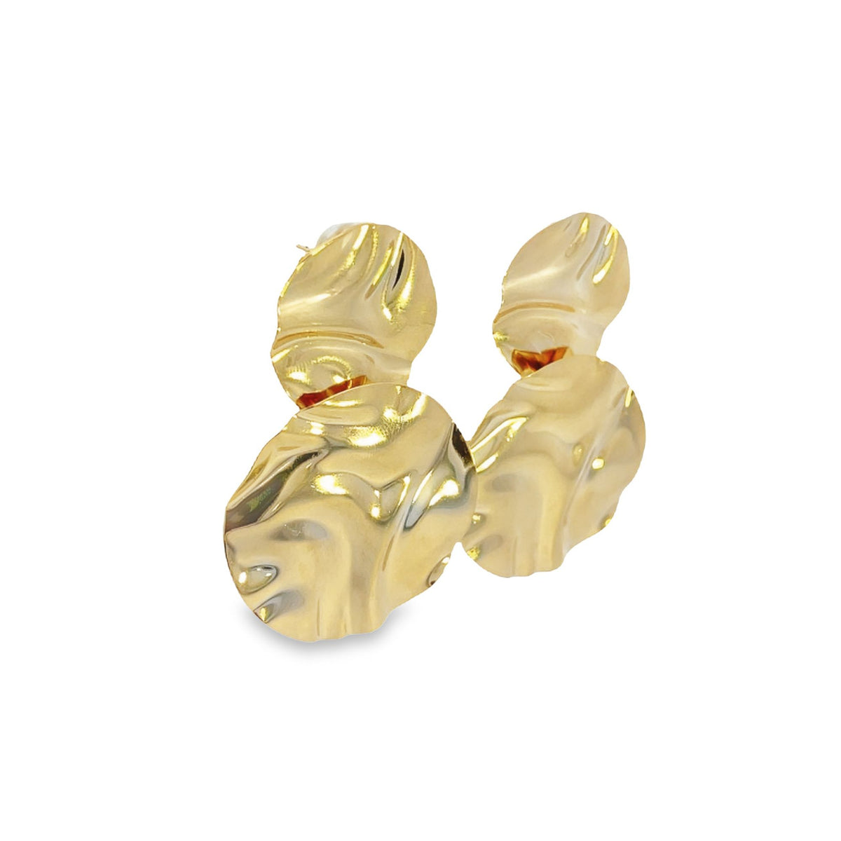 A pair of shiny gold statement earrings features an abstract, hammered design with layered organic shapes against a white background.