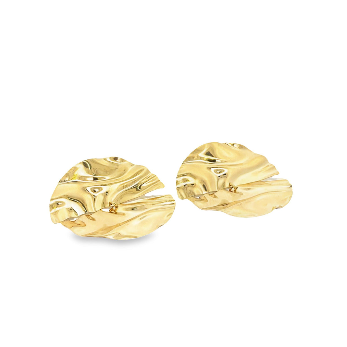 A pair of shiny, abstract gold earrings rests flat against a clean white background, showcasing their rippled, organic textures.