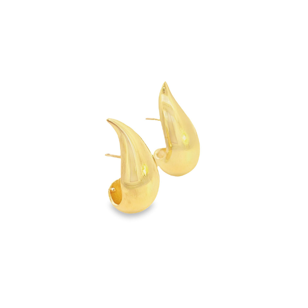 A pair of polished gold teardrop huggie earrings gleams against a clean white background.