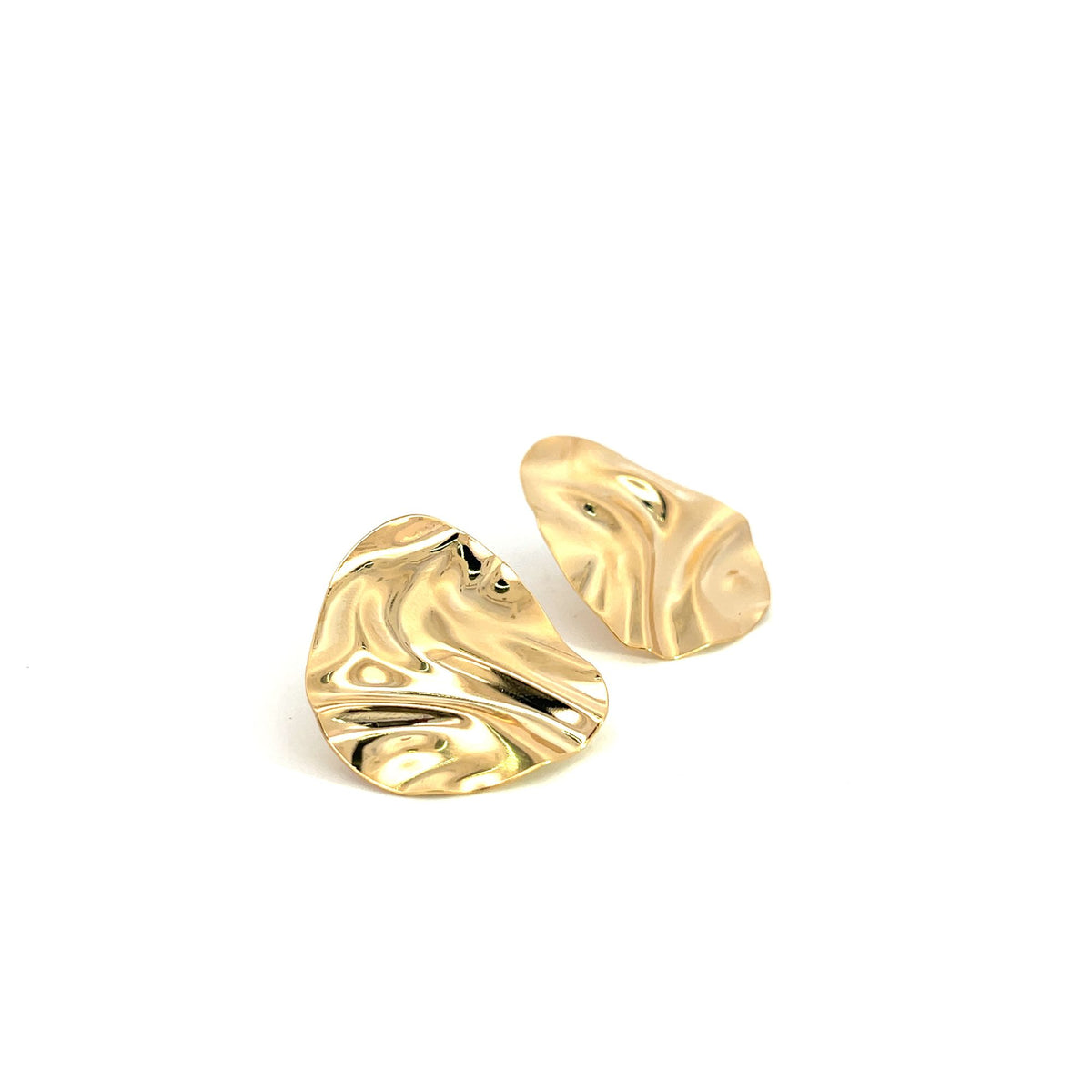 Two shiny gold metallic earrings with an organic, rippled texture rest side-by-side on a plain white surface.