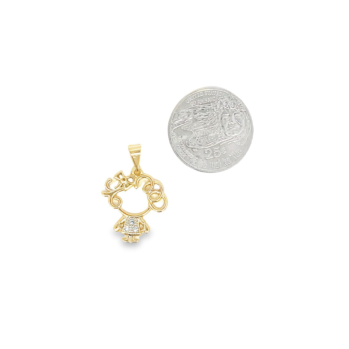 A gold girl-shaped pendant with a sparkling crystal dress rests beside a US quarter for scale.