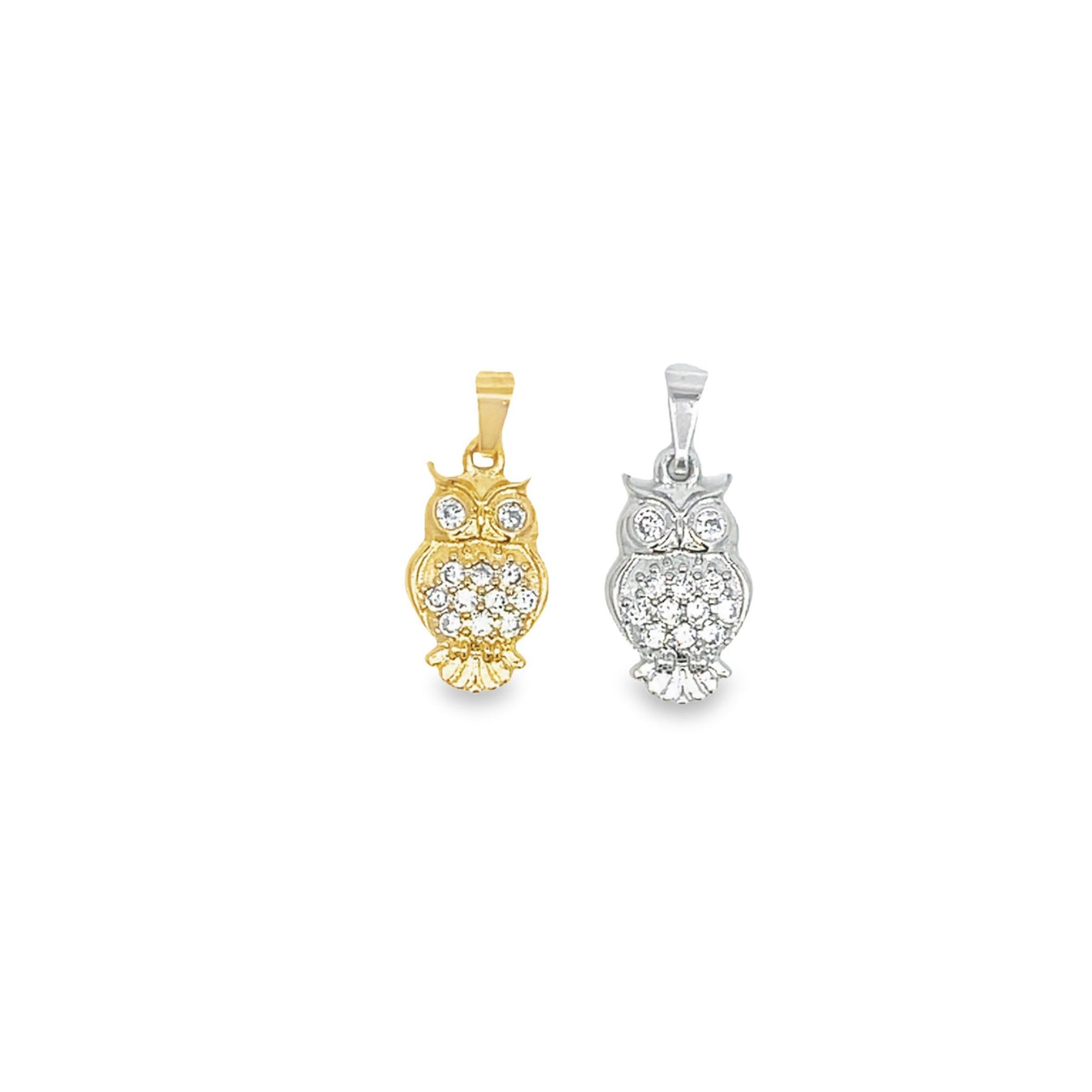 Two sparkling diamond-studded owl pendants, one in yellow gold and the other in silver, rest side by side against a clean white background.