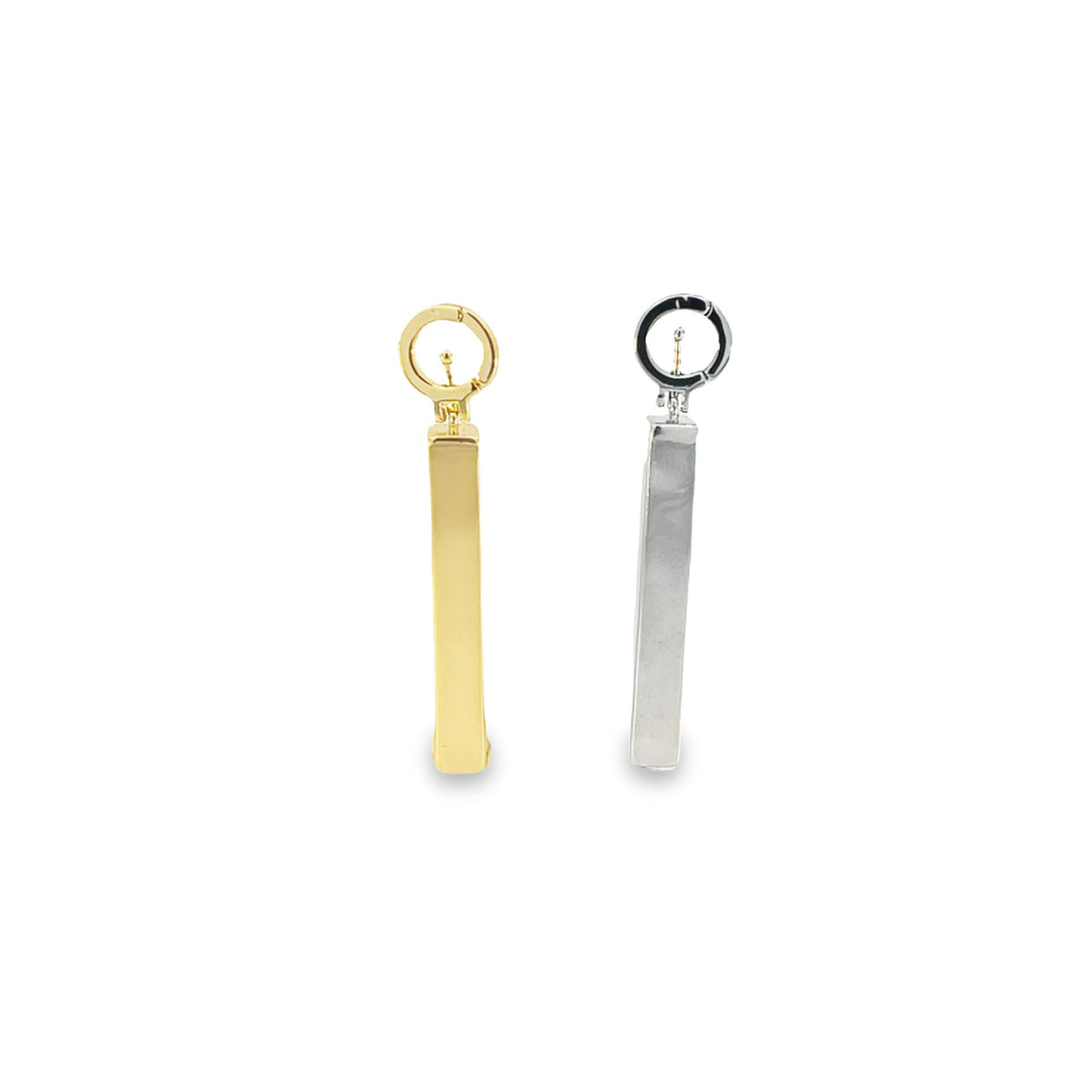 A pair of dangling geometric metal earrings features a gold-tone bar pendant next to a silver-tone rectangular drop earring against a clean white background.