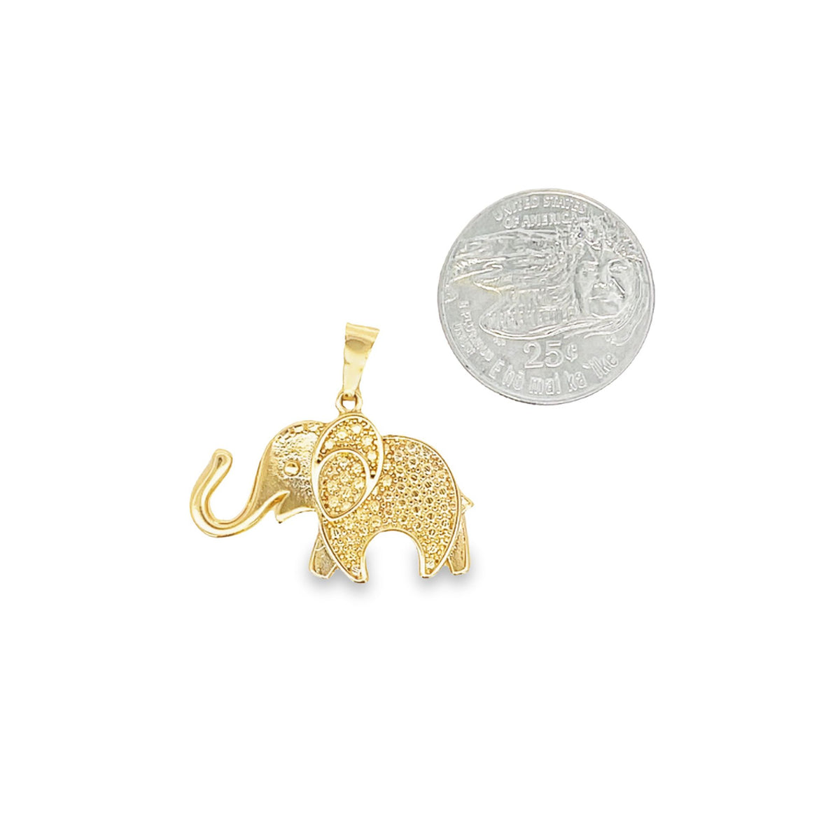 A gold elephant pendant rests next to a quarter for size comparison.