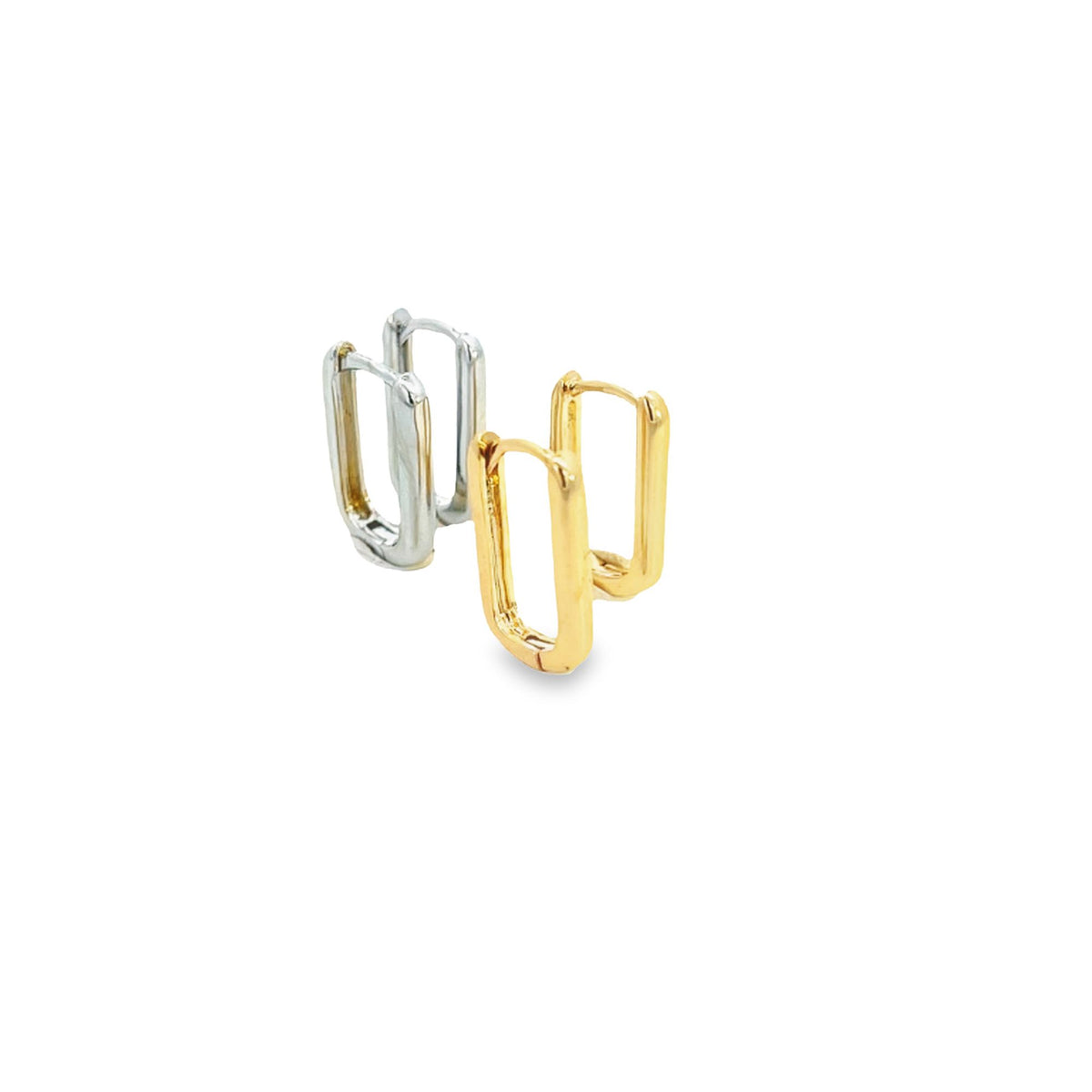 A pair of silver and gold rectangular huggie hoop earrings sit upright against a clean white background.