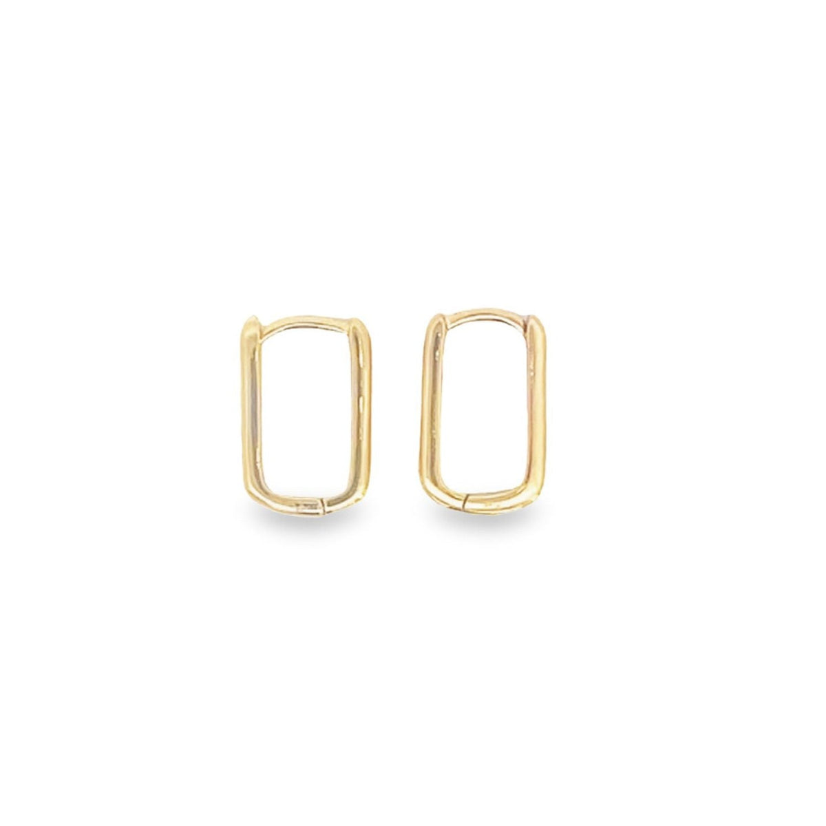 A pair of minimalist gold rectangular huggie hoop earrings rests against a clean white background.