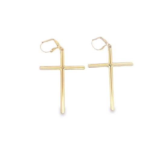 A pair of polished gold cross leverback earrings hangs against a clean white background.