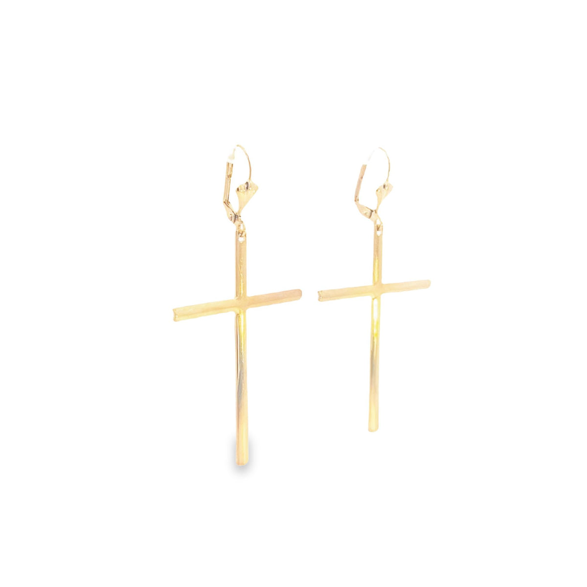 A pair of polished gold cross drop earrings hangs against a clean white background.