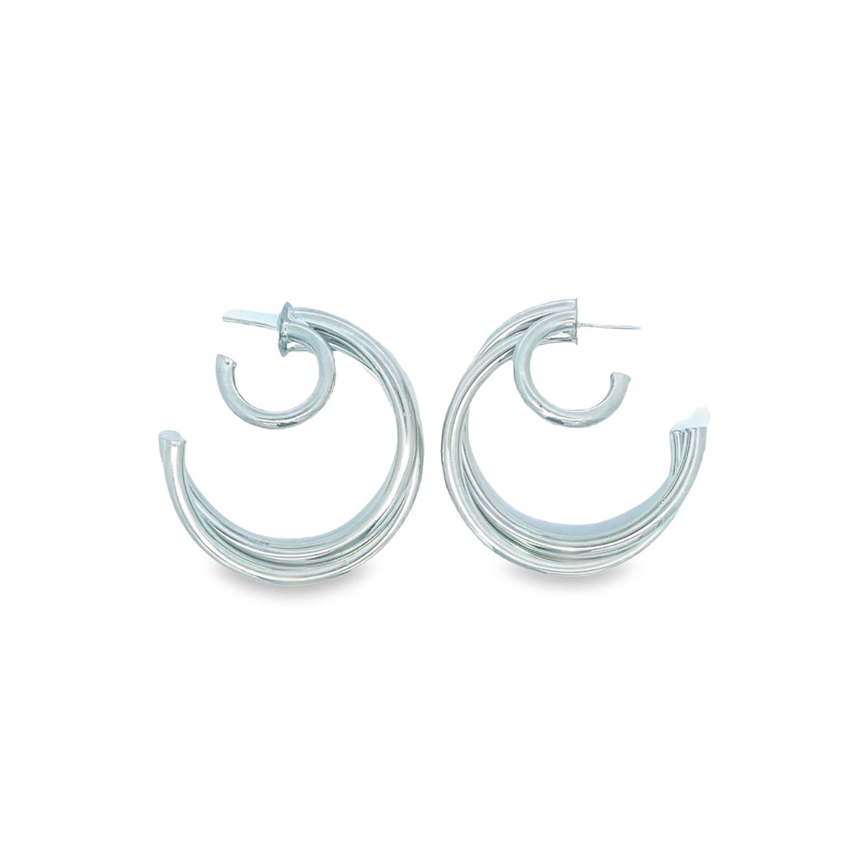 A pair of silver double-layered hoop earrings rests against a clean white background.