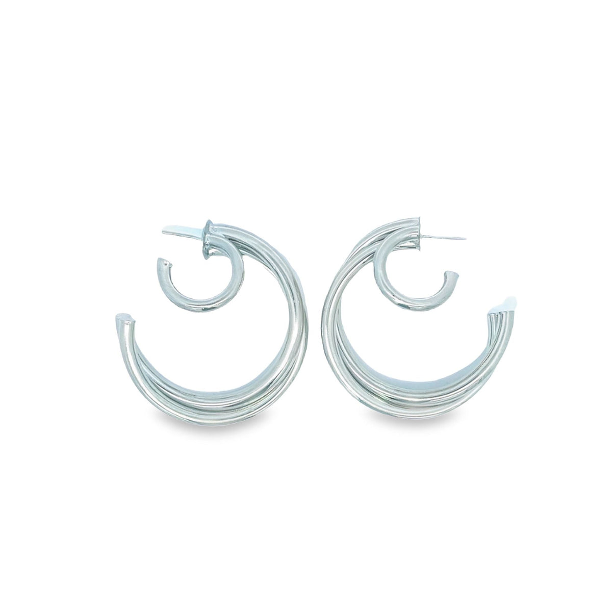 A pair of polished silver double hoop earrings sits side by side against a clean white background.