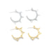 Two pairs of spike hoop earrings in polished silver and gold rest against a white background.