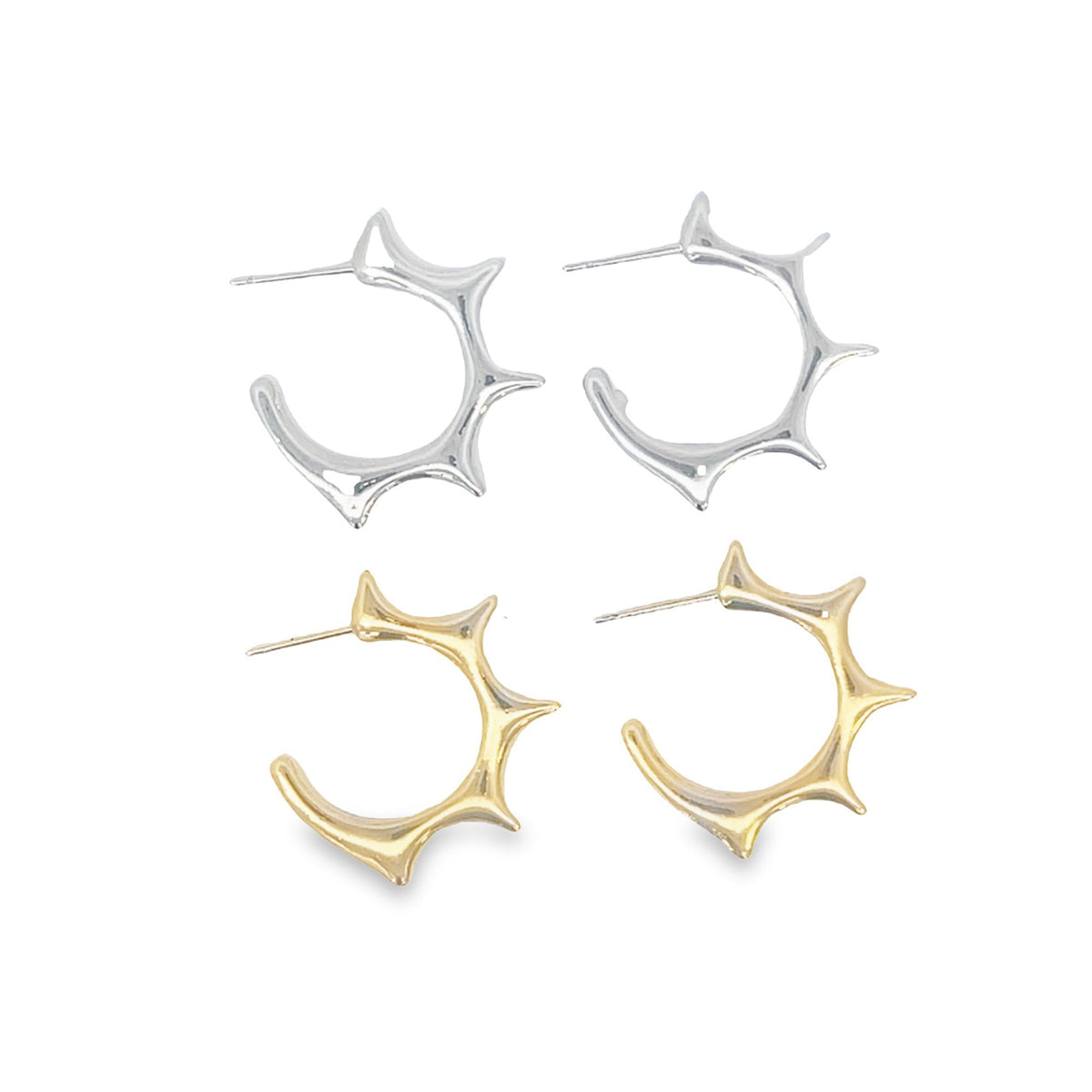 Two pairs of spiky, starburst-shaped hoop earrings in silver and gold are displayed against a clean white background.
