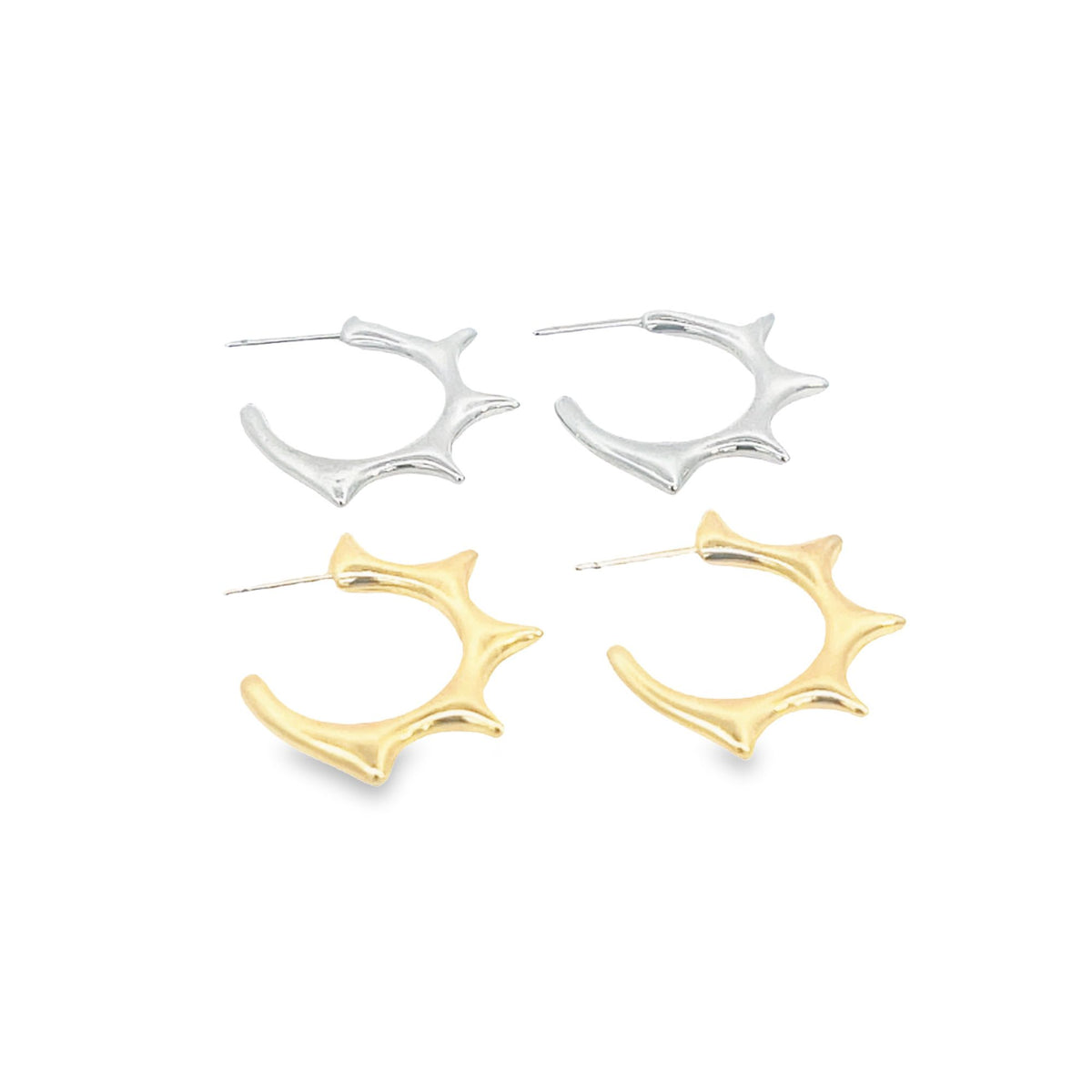 Two pairs of spiky, open-hoop earrings display polished silver and gold finishes against a white background.