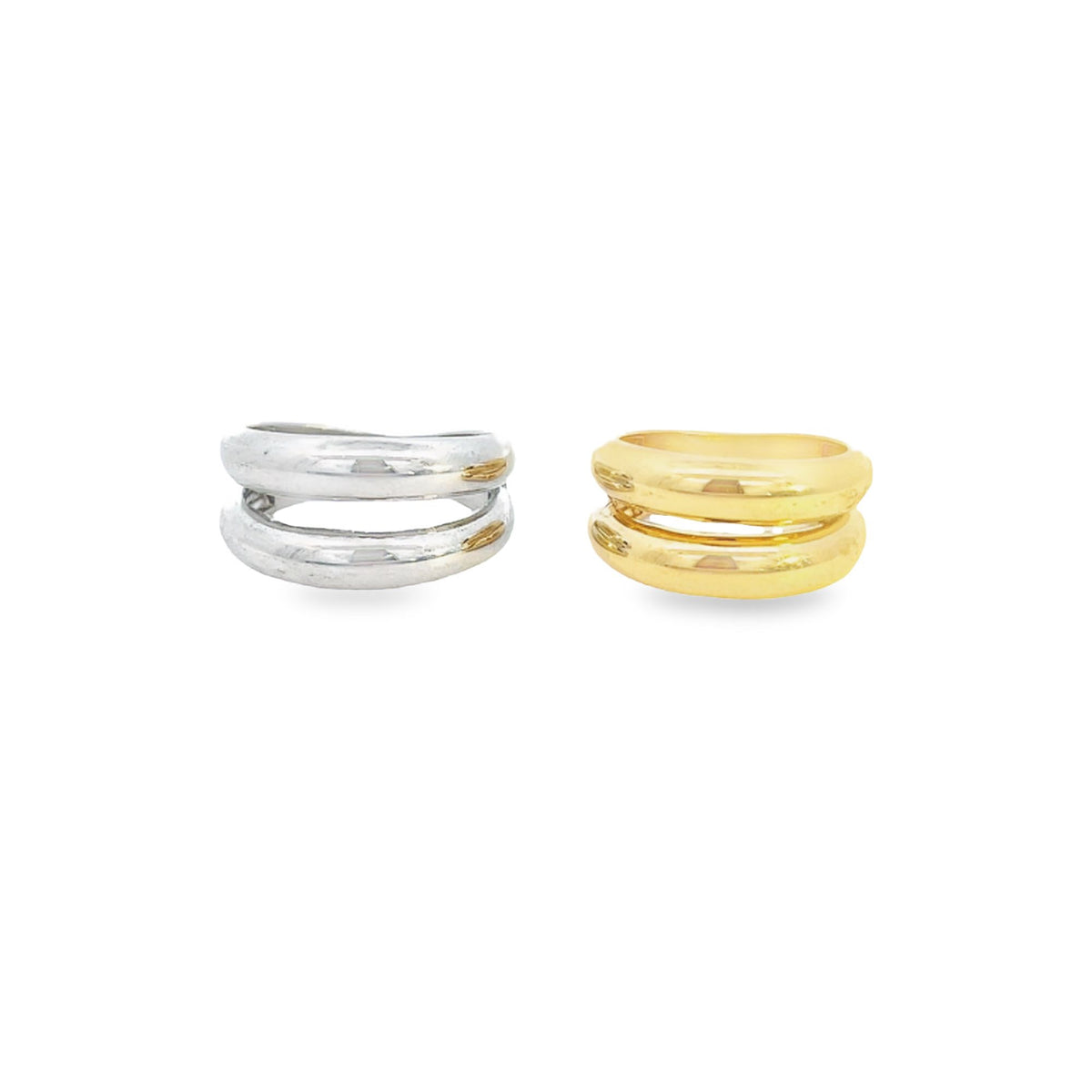 Two stacked double-band rings, one silver and one gold, rest side by side on a plain white background.