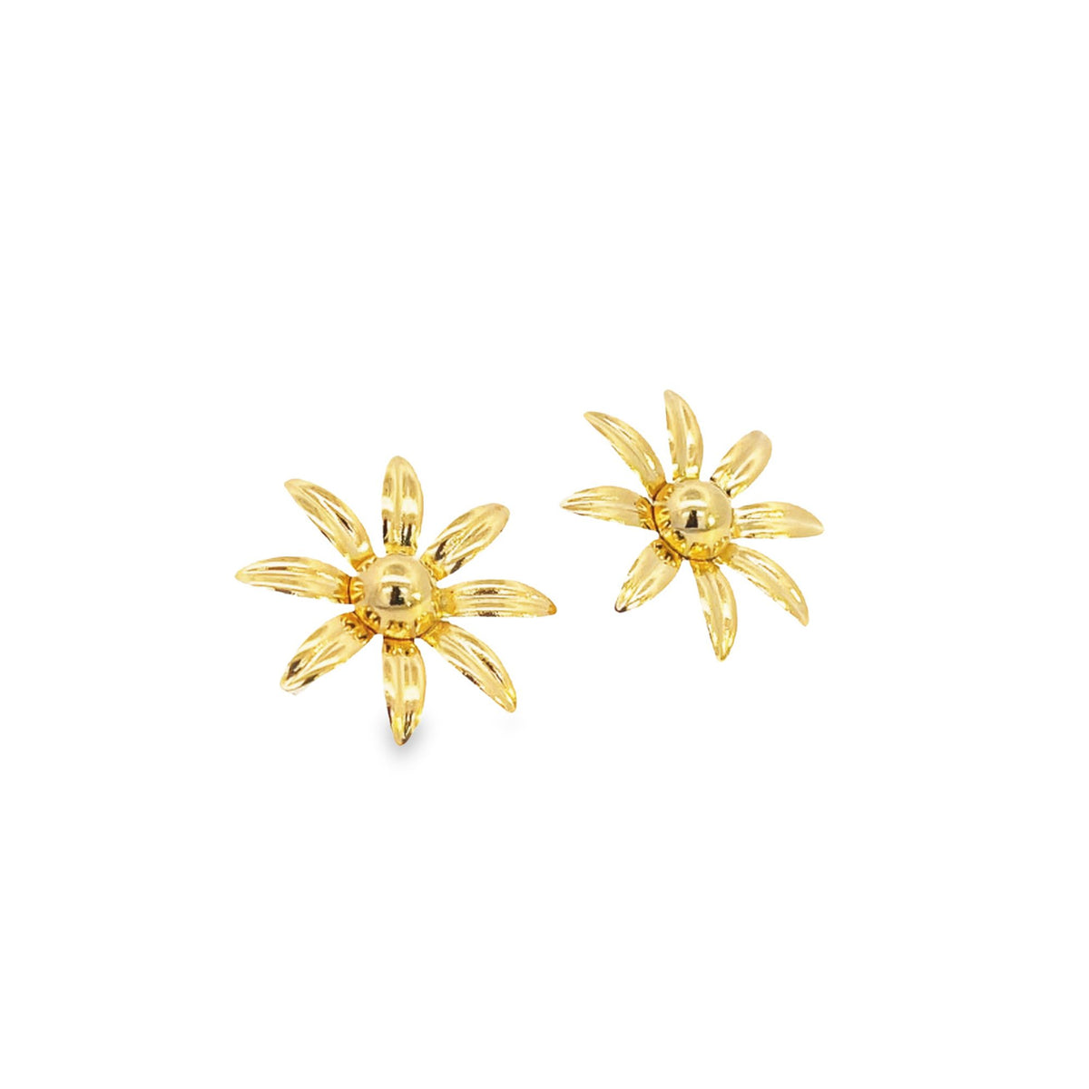 A pair of polished gold daisy flower stud earrings gleams against a clean white background.