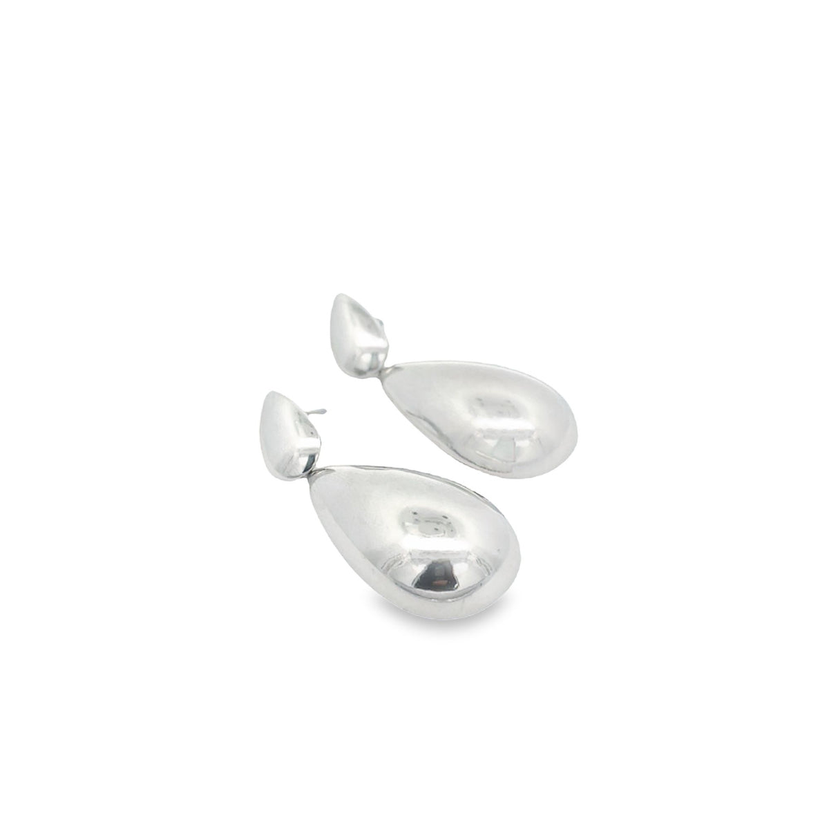 A pair of polished silver teardrop earrings rests against a clean white background.