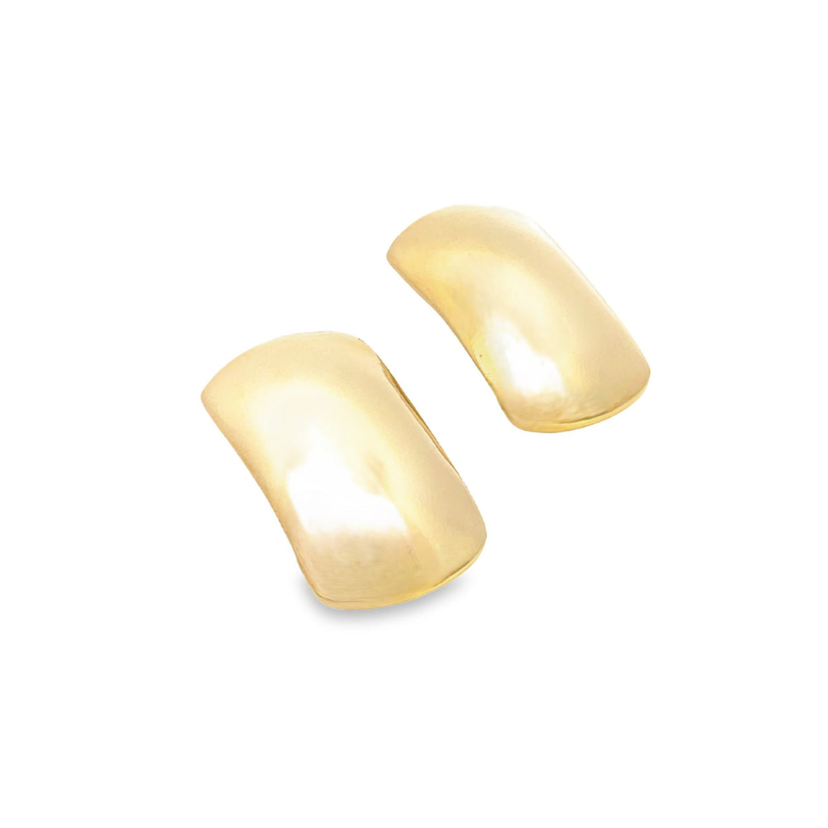 A pair of smooth, curved gold dome stud earrings rests against a clean white background.