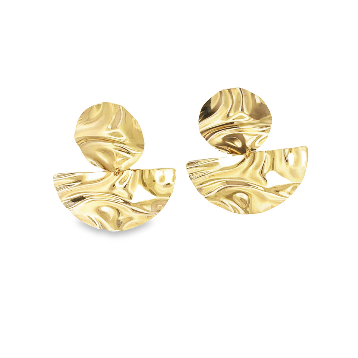 A pair of statement gold earrings featuring abstract, hammered crescent and disc shapes resting against a white background.