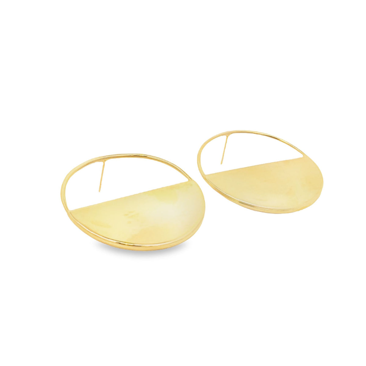 A pair of modern gold earrings featuring a half-circle design rests against a clean white background.