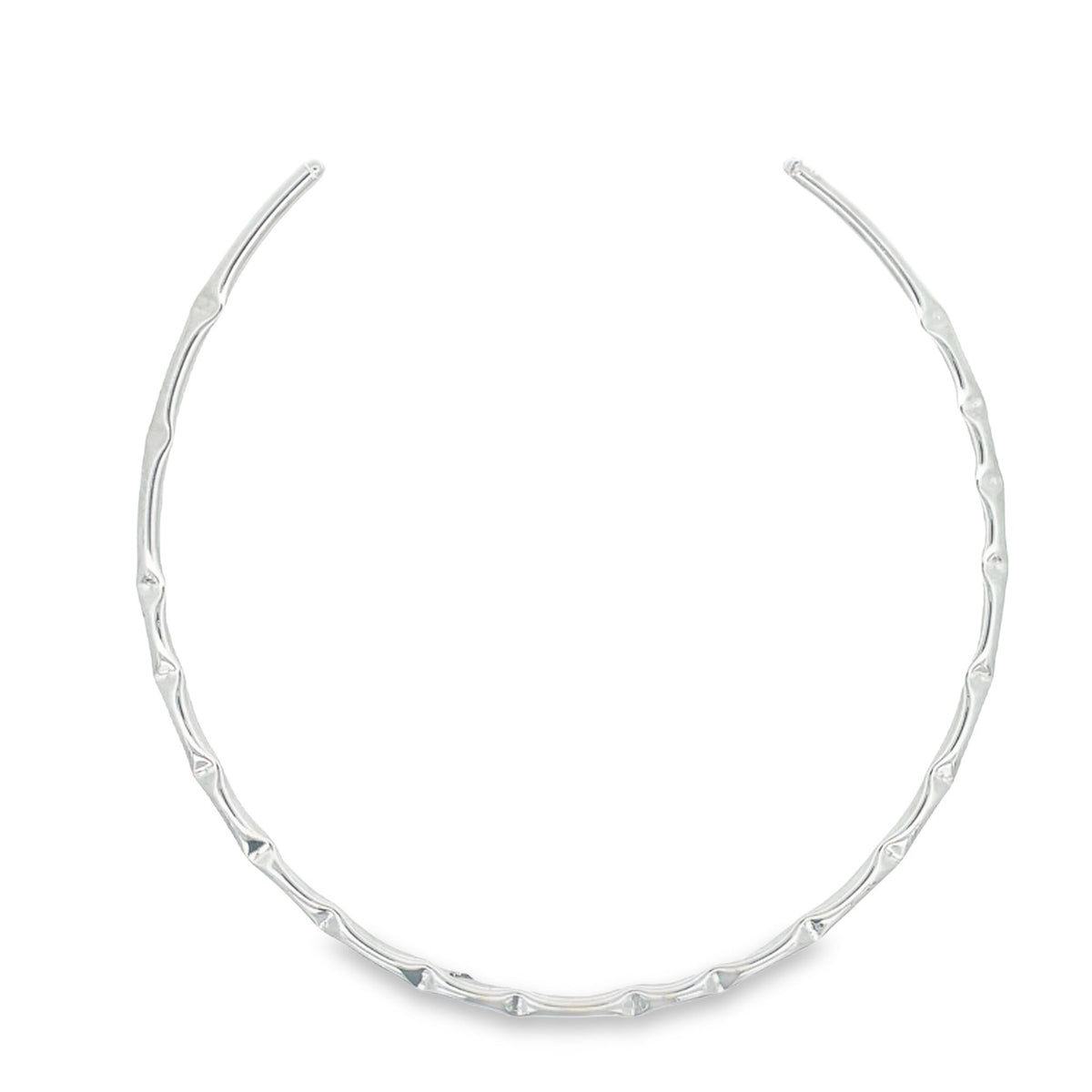 A sleek, silver-toned metal choker necklace displays an organic, bamboo-like textured design against a clean white background.