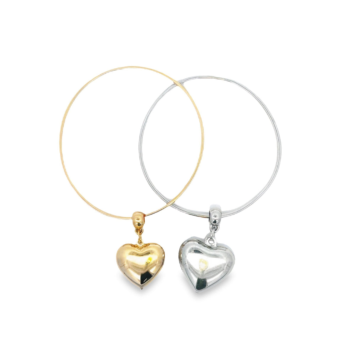 Two interlocking wire bangles, one gold and one silver, each feature a dangling heart charm against a plain white background.