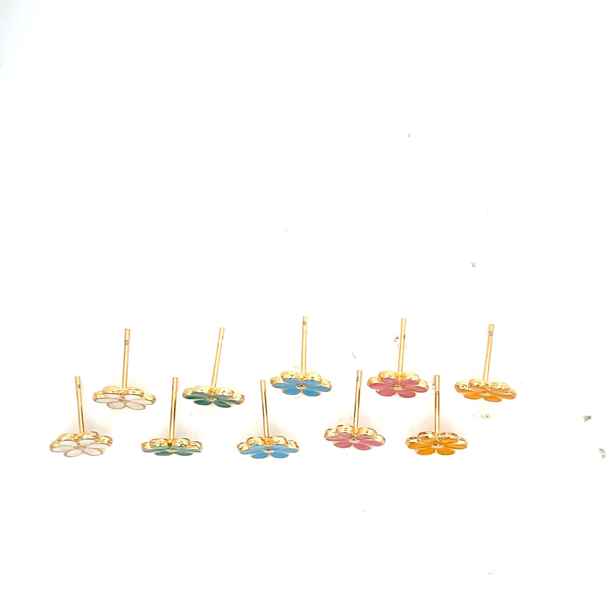 A colorful collection of enamel flower stud earrings with gold plating rests on a white background.