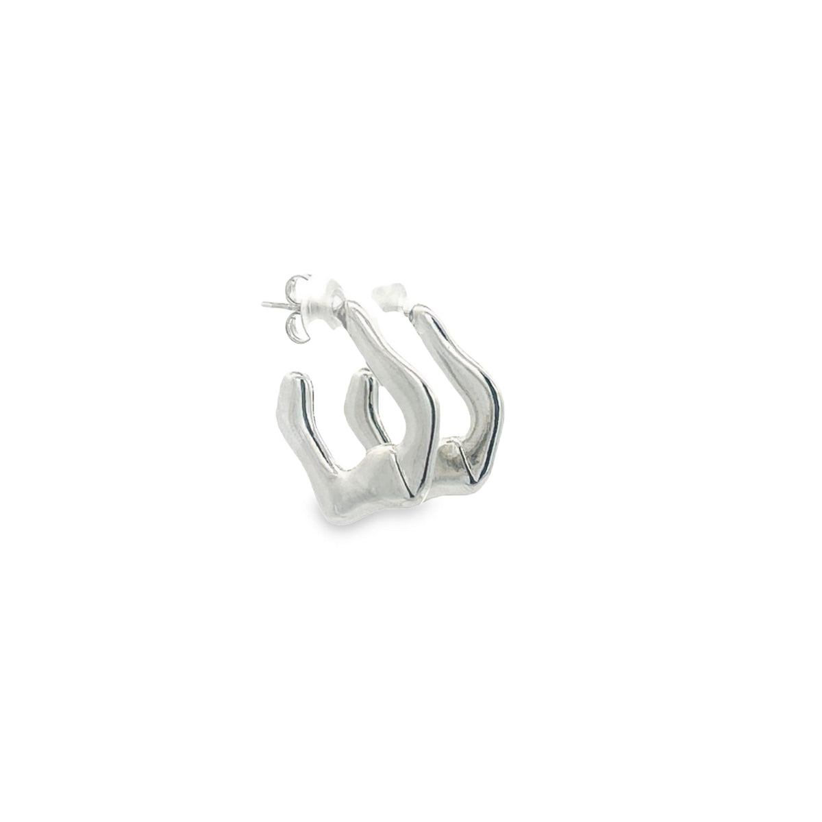 A pair of unique silver hoop earrings featuring a modern, angular design rests against a clean white background.