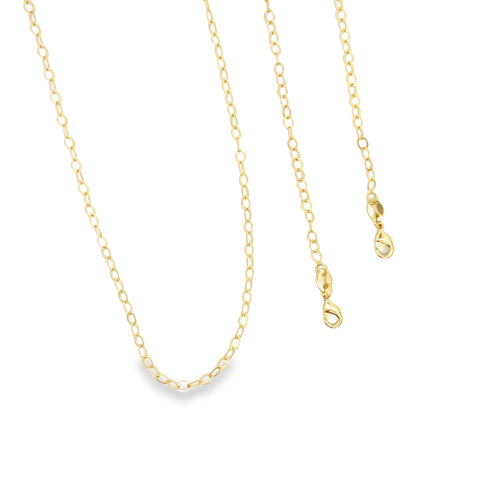 A delicate gold chain necklace with a lobster clasp hangs against a white background.