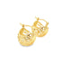 A pair of polished gold filigree hoop earrings gleams against a white background.