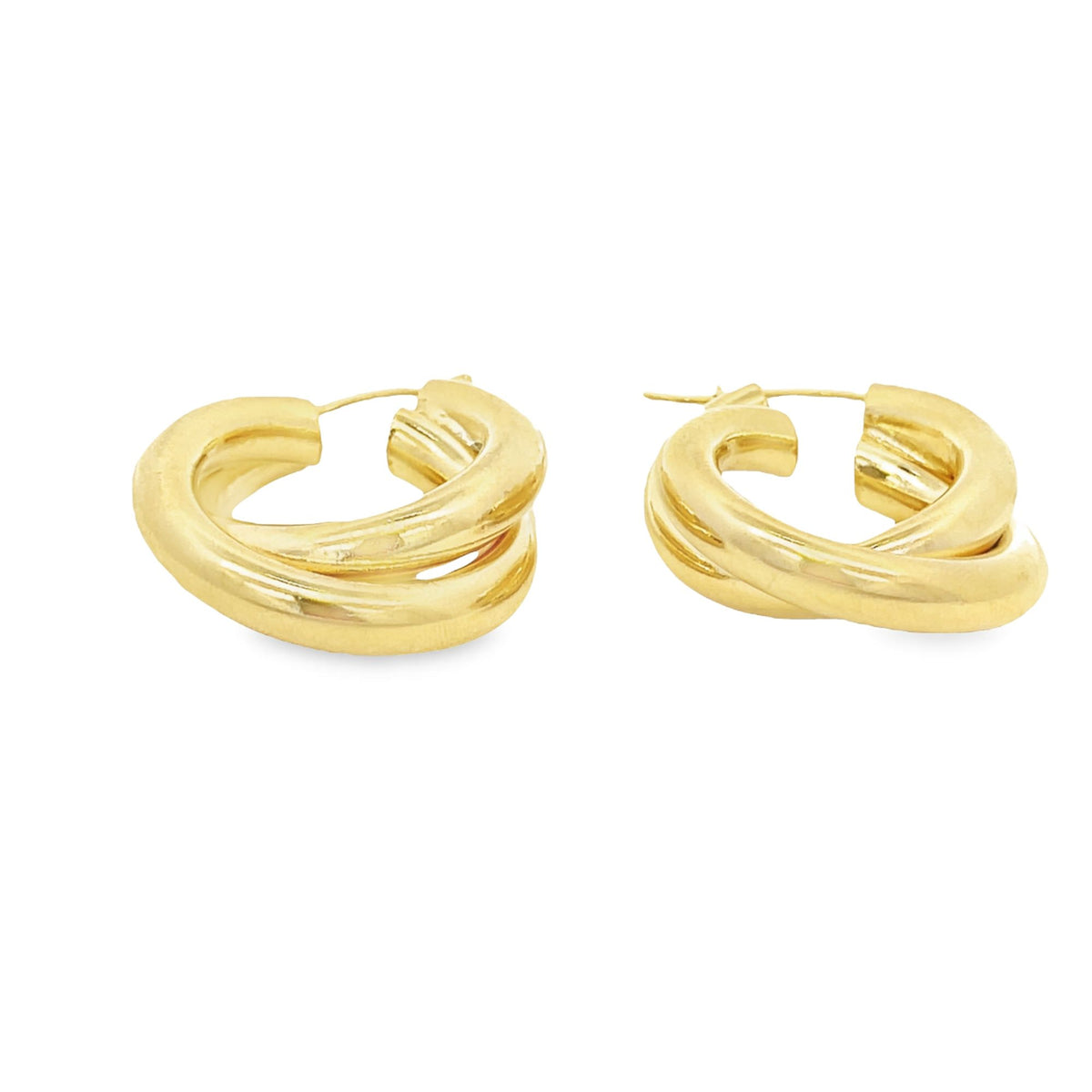 A pair of thick, interlocking gold hoop earrings rests against a clean white background.