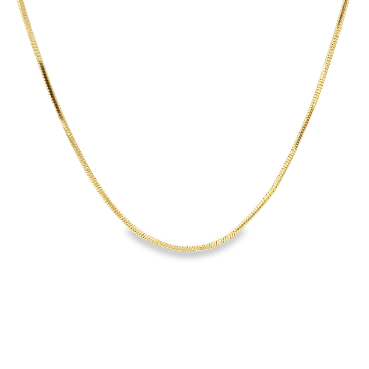 A sleek gold snake chain necklace rests against a clean white background.